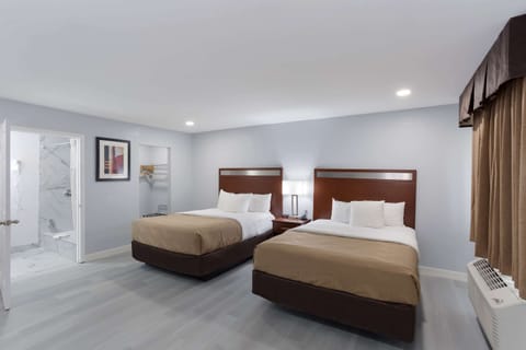 Premium bedding, down comforters, Tempur-Pedic beds, laptop workspace