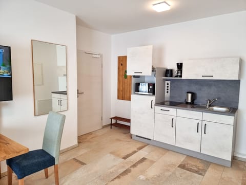 Comfort Apartment | Private kitchen | Full-size fridge, microwave, stovetop, coffee/tea maker