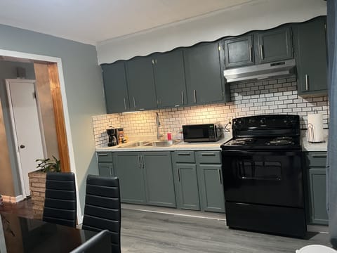 Full kitchen w/ refrigerator, stove, table & chairs for 6 and washer and dryer.