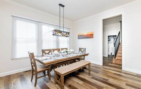 Gather around the table and enjoy the breathtaking views of the countryside in this modern rustic dining area, designed for memorable meals and unforgettable moments. With seating for up to 10 guests.