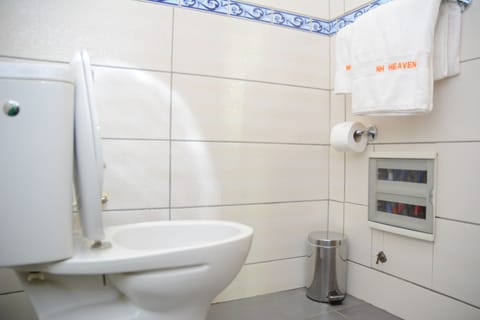 Deluxe Room | Bathroom | Rainfall showerhead, designer toiletries, hair dryer, bathrobes