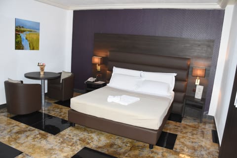 Deluxe Room | Pillowtop beds, in-room safe, individually decorated