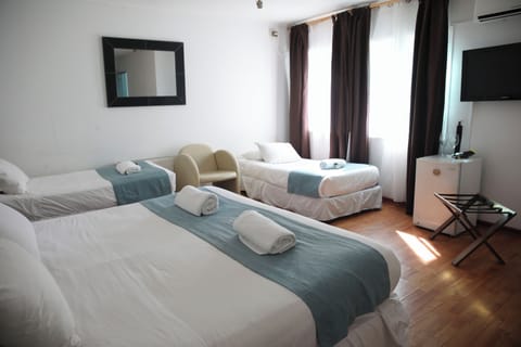 Family Quadruple Room | Minibar, in-room safe, free cribs/infant beds, free WiFi