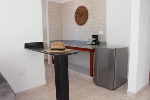 Mini-fridge, espresso maker, griddle, dining tables