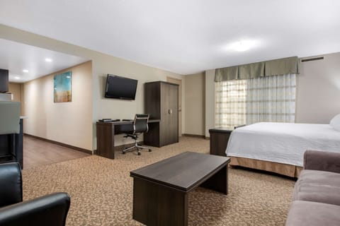 Suite, 1 King Bed, Non Smoking | Pillowtop beds, desk, blackout drapes, iron/ironing board