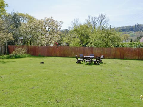 Large lawned garden with furnished area for sitting out | Yawl House, Uplyme, near Lyme Regis
