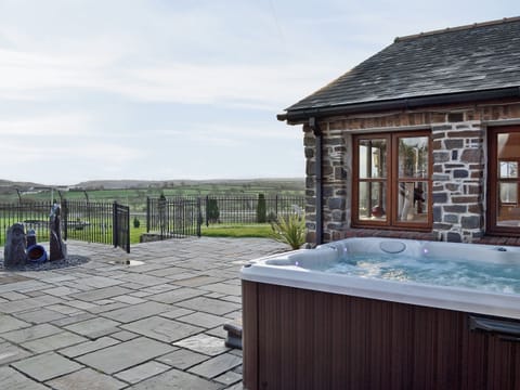 Hot tub | Ty Cerrig Farmhouse, St Clears, nr. Laugharne