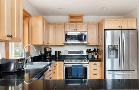 View of the kitchen from the peninsula/bar seating.