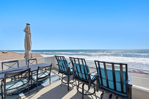 Beachfront patio with sweeping coastal views