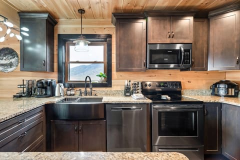 5-burner electric stove and all major appliances, lots of cabinets.