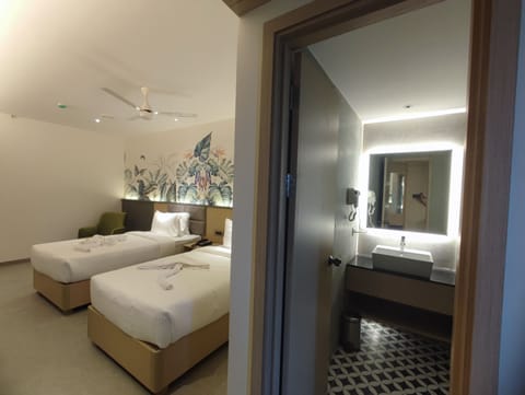 Deluxe Double or Twin Room | Minibar, in-room safe, individually decorated, individually furnished