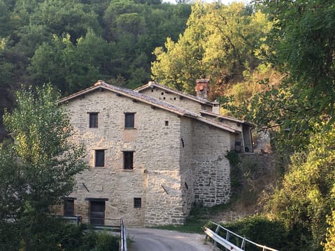 returning to the molino at sundown.. bridge over the waterfall 