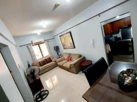 Standard Apartment, 3 Bedrooms | Living area | 70-inch LED TV with cable channels