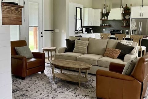 Snuggle up in this charming and cozy living room.