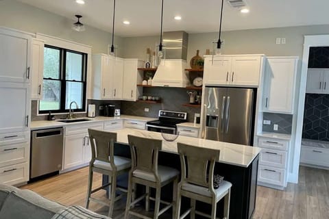 Cozy kitchen with stools for extra seating and convenience.