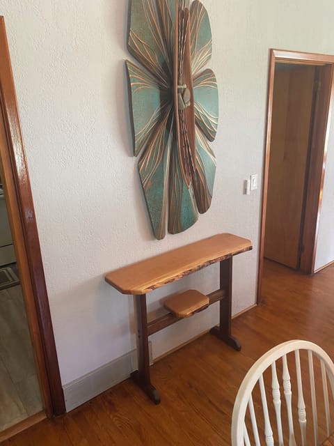 Custom wall art, blown glass, paintings, handcrafted furnishings adorn the home.