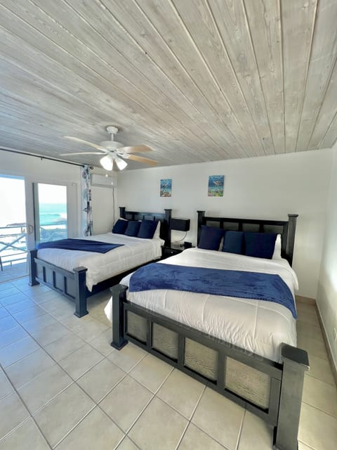 Standard Double Room, 2 Queen Beds, Ocean View, Beachfront | Minibar, in-room safe, individually decorated, individually furnished