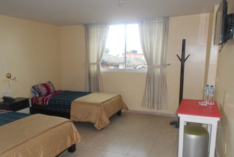 Family Triple Room, 1 Bedroom, City View | Down comforters, Select Comfort beds, individually decorated