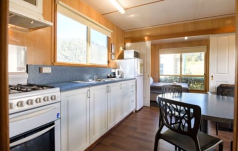 Standard 2 Bedroom Cabin | Private kitchen | Full-size fridge, microwave, stovetop, coffee/tea maker