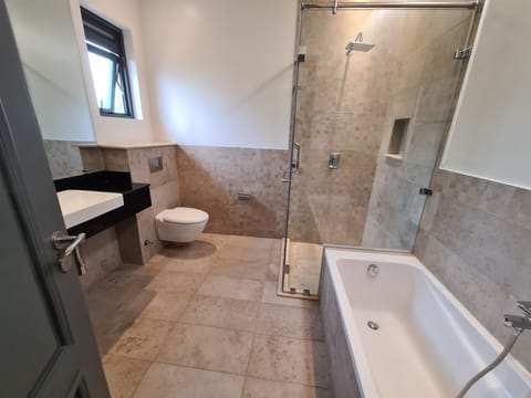 Separate tub and shower, rainfall showerhead, hair dryer, bathrobes