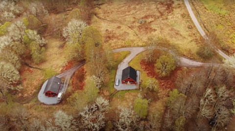 Oak Lodge (Left) & Pine Lodge (Right) in secluded woodland site.