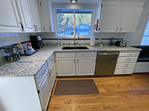 Kitchen sink has Insta-Hot water. Window looks toward Haynes Conservation Park.