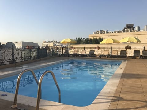 Outdoor pool, open 9:30 AM to 6:30 PM, pool umbrellas, sun loungers