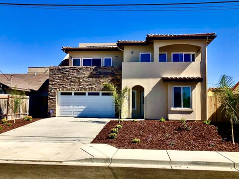 Front view of property. 3 story Modern home with 4br/4ba and a garage.
