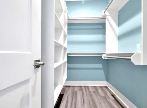 Wow! So much room to store overflow items in this large master closet.