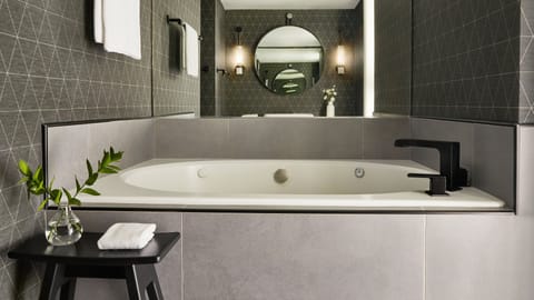 Suite, 1 Bedroom | Bathroom | Combined shower/tub, designer toiletries, hair dryer, bathrobes