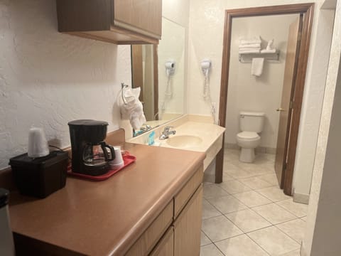 Standard Room, 2 Queen Beds, Non Smoking | Bathroom | Combined shower/tub, hair dryer, towels