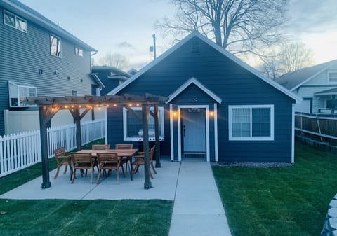 Outdoor area with grill, dining table and firepit