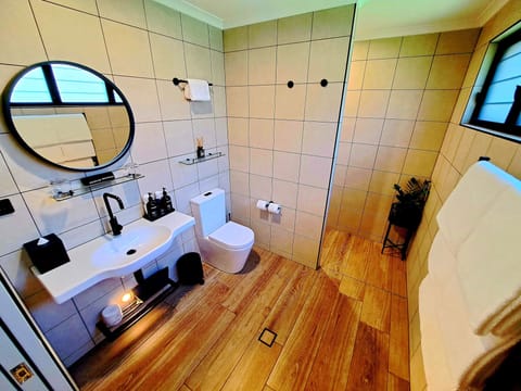 Luxury Suite, Beach View, Ground Floor | Bathroom | Shower, hair dryer, bathrobes, slippers