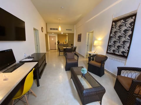 Family Room, Multiple Beds, Non Smoking, City View | Living area | 32-inch TV with satellite channels