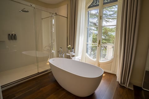 Grand Suite | Bathroom | Designer toiletries, hair dryer, bathrobes, slippers