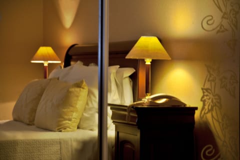 Standard Double Room | Minibar, in-room safe, desk, blackout drapes