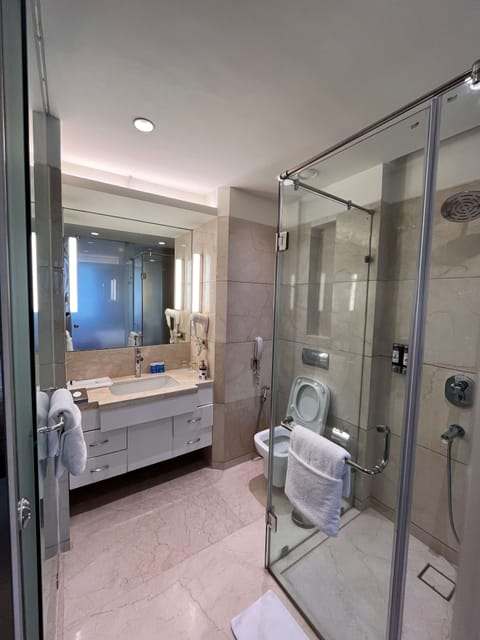 Junior Suite, 1 Double Bed | Bathroom | Combined shower/tub, free toiletries, hair dryer, slippers