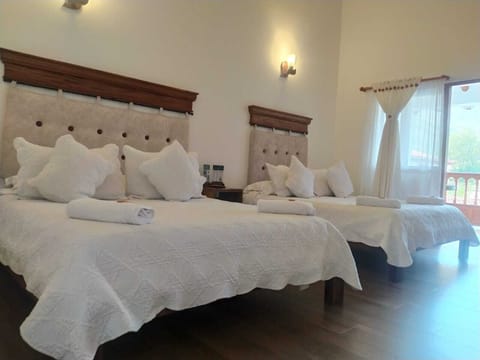 Deluxe Quadruple Room | Premium bedding, down comforters, free WiFi, bed sheets