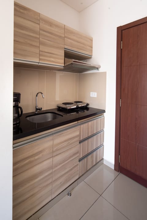 Standard Suite, 1 Queen Bed | Private kitchen | Mini-fridge, microwave, dishwasher, toaster