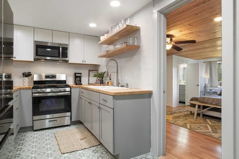 The full kitchen has modern appliances and plenty of cookware and dining ware. All it needs is your culinary creativity!