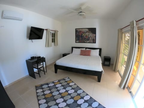 Deluxe Suite, 1 King Bed with Sofa bed, Patio, Pool View | 1 bedroom, in-room safe, iron/ironing board, free WiFi