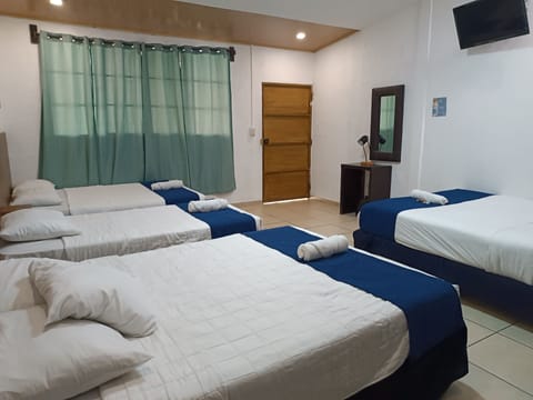 Family Quadruple Room | Blackout drapes, iron/ironing board, free WiFi, bed sheets