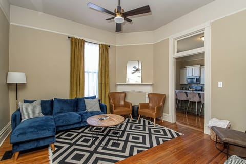 Living area with smart TV and plenty of seating.