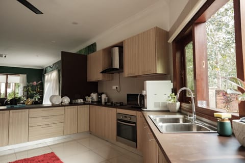 Villa Rainforest | Private kitchen | Full-size fridge, microwave, oven, stovetop