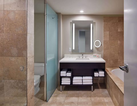 Room, 1 King Bed, Jetted Tub | Bathroom | Designer toiletries, hair dryer, bathrobes, towels