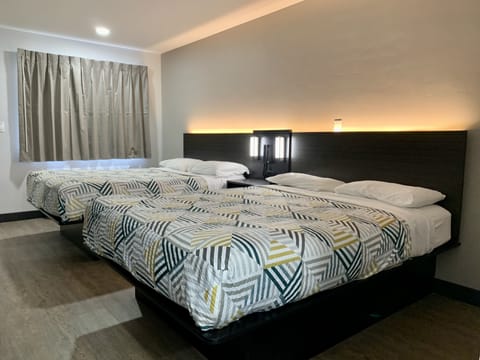 Premium Room, 2 Queen Beds, Non Smoking, Refrigerator & Microwave | Free WiFi, bed sheets