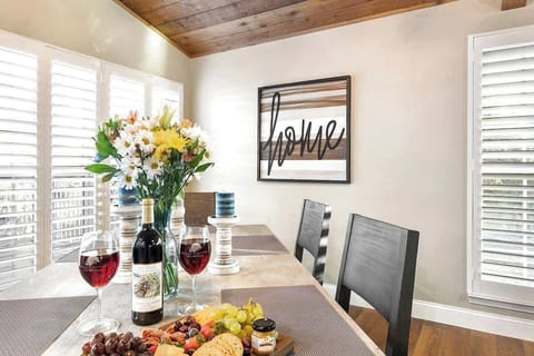 Indulge in delicious meals and lively conversation at our dining area table.