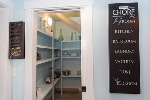 The spacious kitchen pantry keeps everything organized and within reach