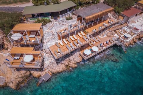 Private beach, black sand, sun loungers, beach umbrellas