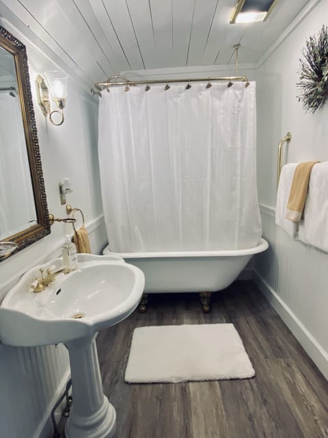 Combined shower/tub, deep soaking tub, hair dryer, bathrobes